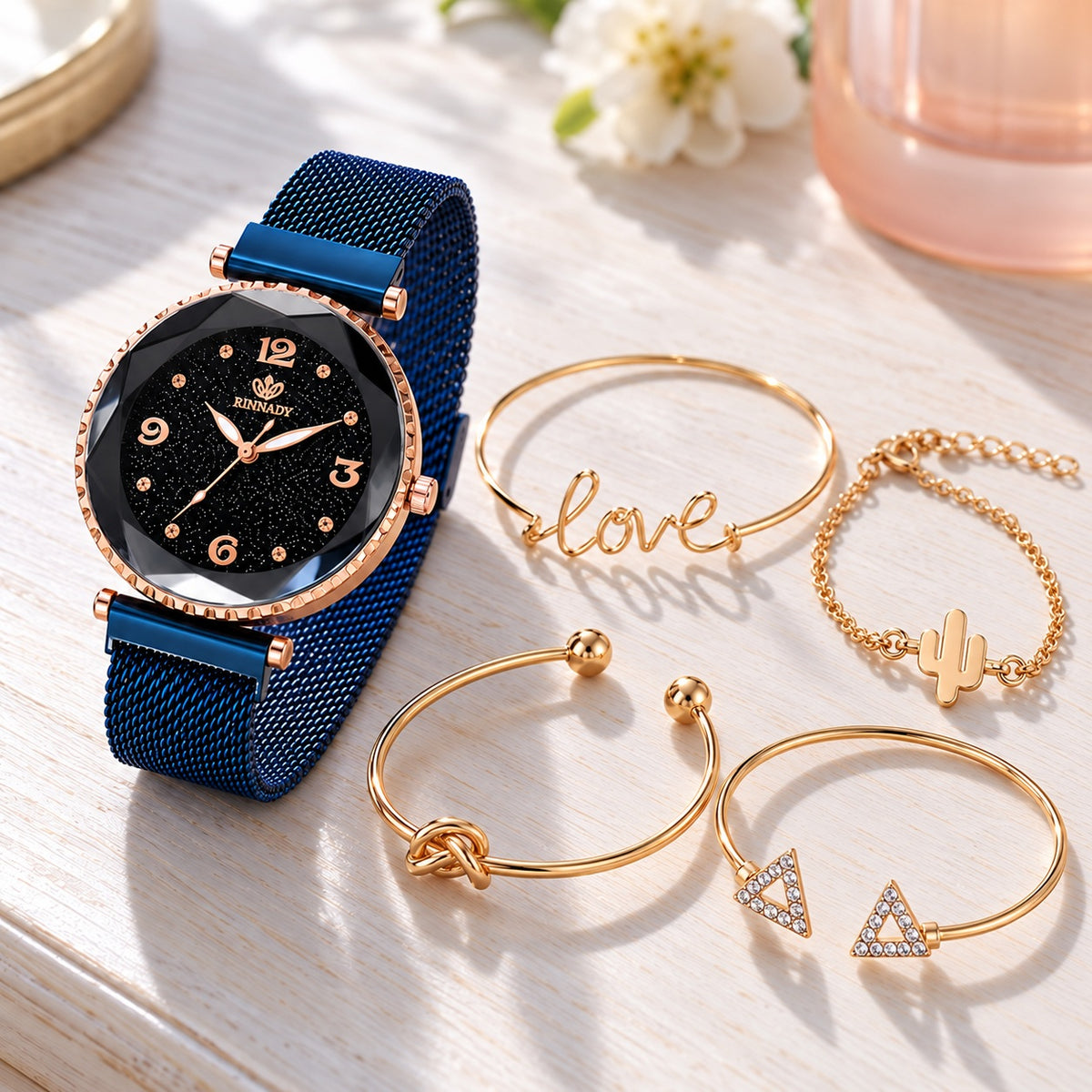 Coffret Montre Femme Ciel Étoilé et Joncs Dorés – maille bleue + 4 joncs dorés
